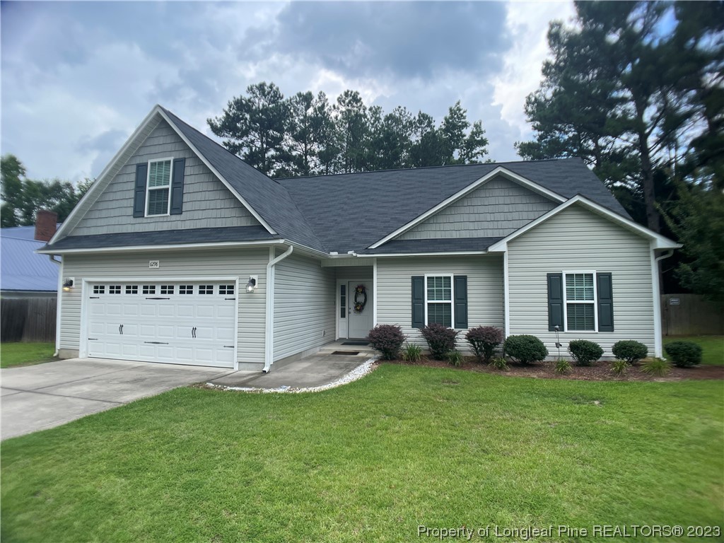 6298 Phillipi Church Road Raeford, NC 28376 - Photo 2 of 31 a view of a house with backyard
