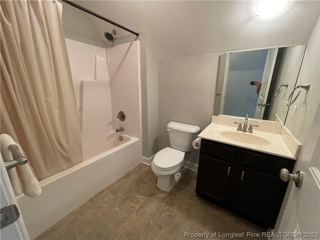 6298 Phillipi Church Road Raeford, NC 28376 - Photo 26 of 31 a bathroom with a sink toilet and shower