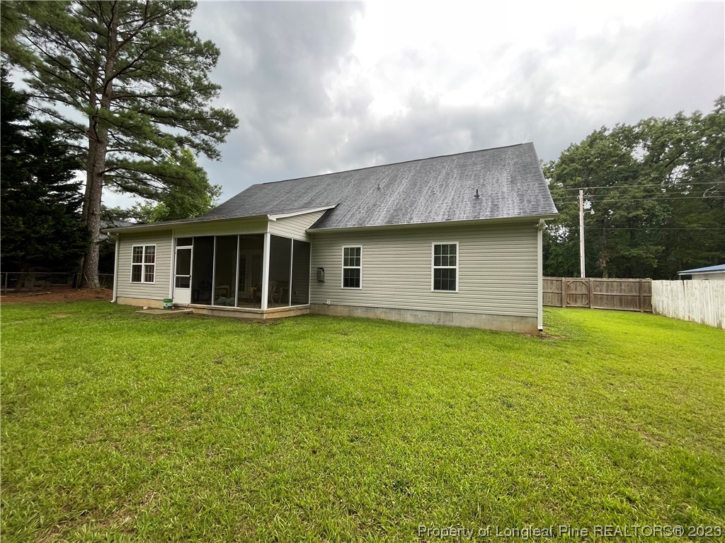 6298 Phillipi Church Road Raeford, NC 28376 - Photo 31 of 31 a front view of a house with a garden