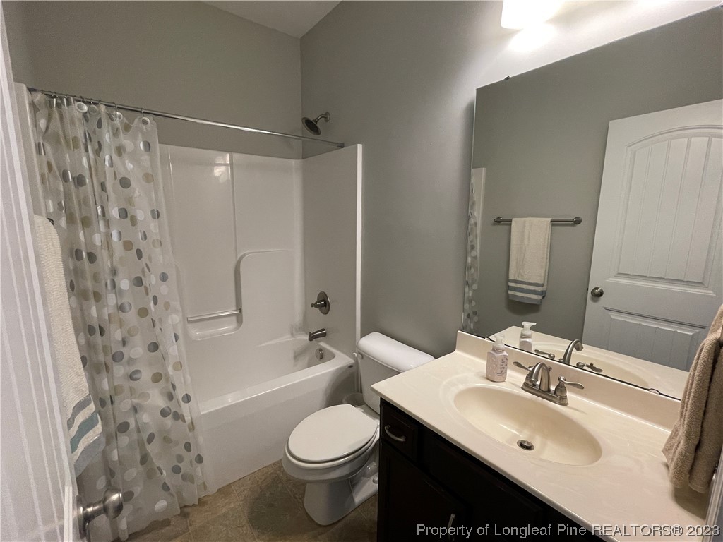 6298 Phillipi Church Road Raeford, NC 28376 - Photo 4 of 31 a bathroom with a sink toilet and shower