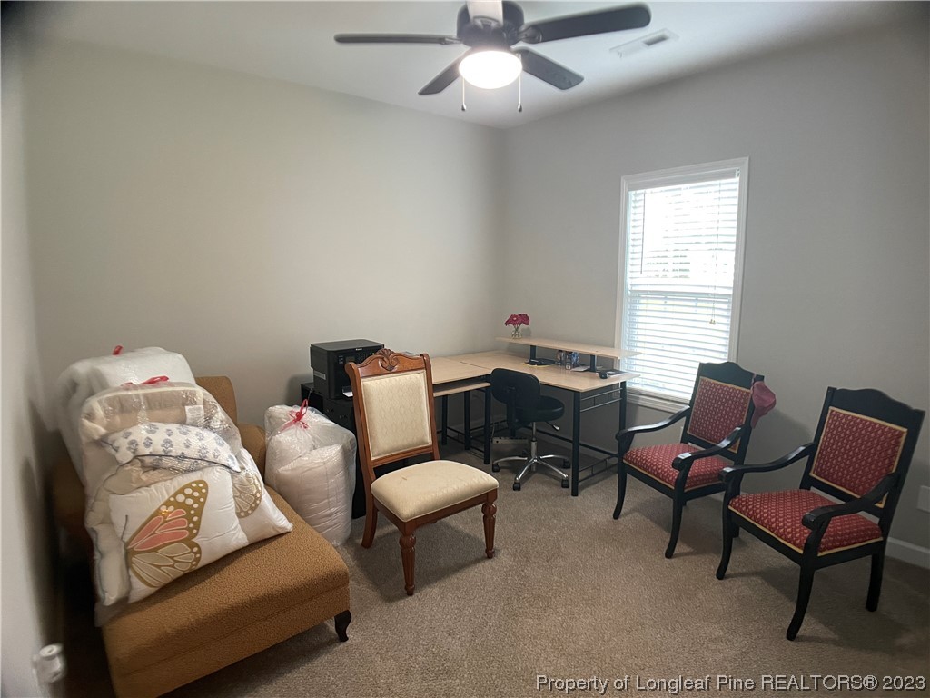 6298 Phillipi Church Road Raeford, NC 28376 - Photo 6 of 31 a living room with furniture and a window