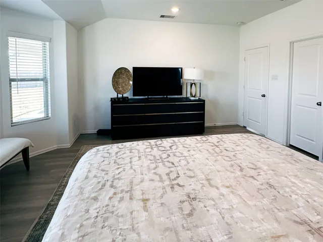 a living room with a couch and a flat screen tv