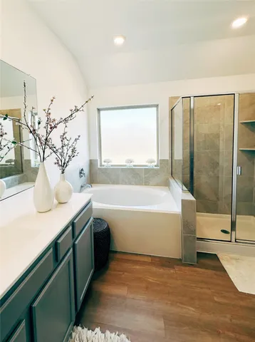 a view of bathroom with bathtub and shower