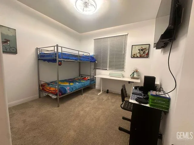 a bedroom with bed and a window