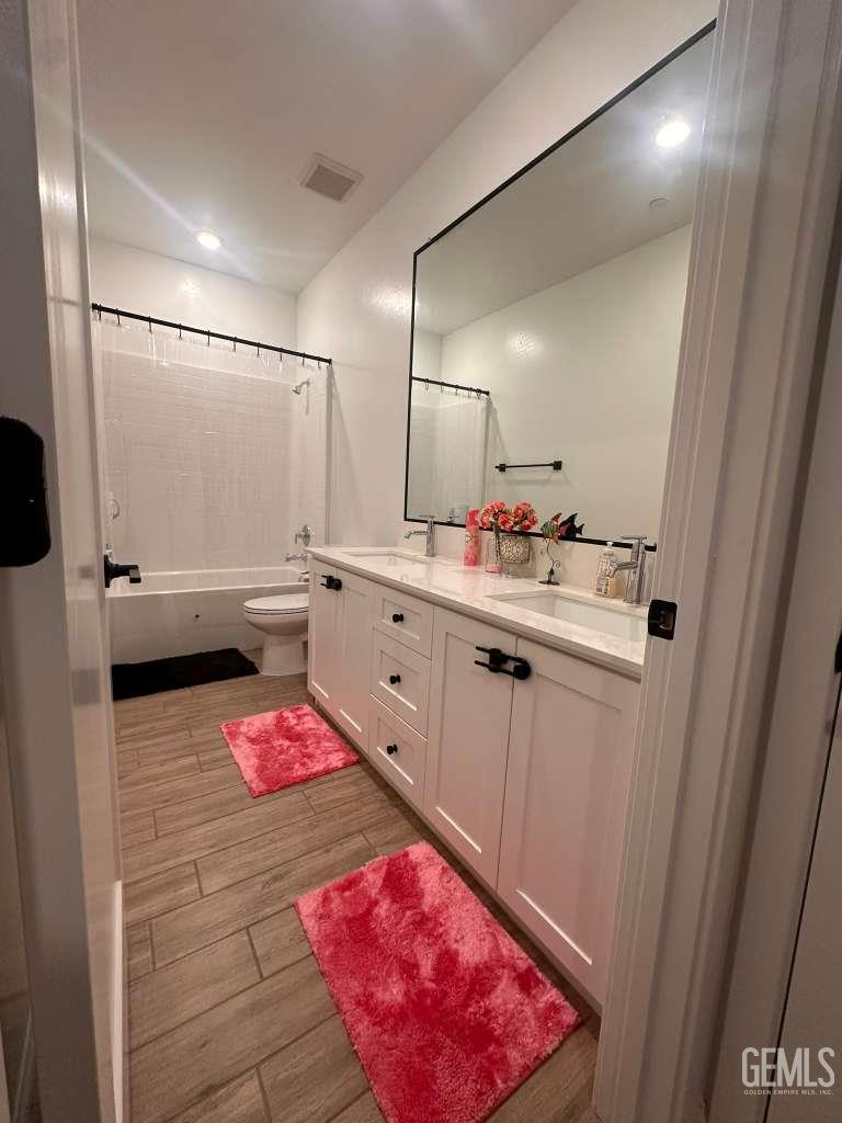 Undisclosed Address Shafter, CA 93263 - Photo 17 of 25 a bathroom with a sink vanity and mirror