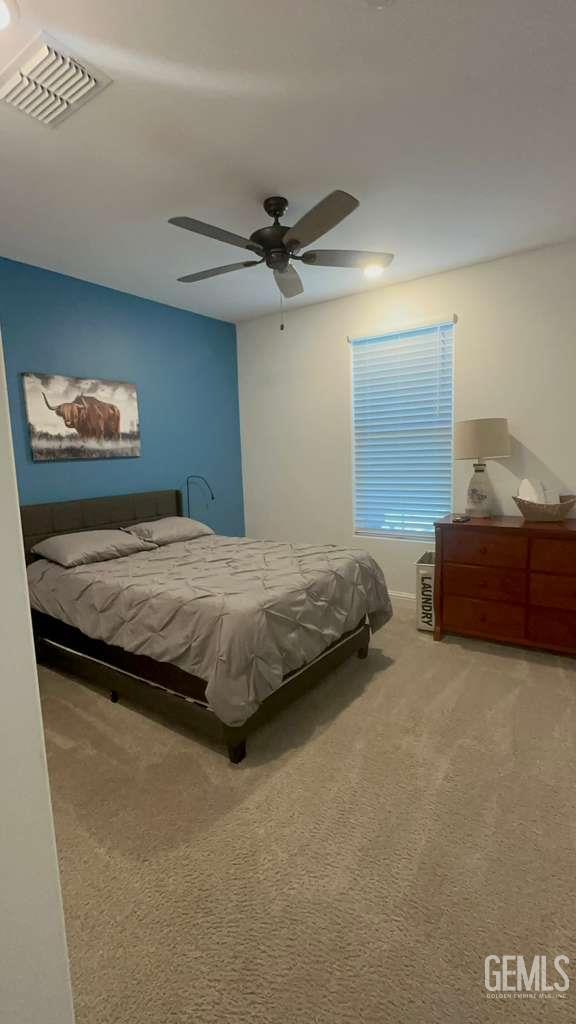 Undisclosed Address Shafter, CA 93263 - Photo 19 of 25 a bedroom with a bed and a ceiling fan