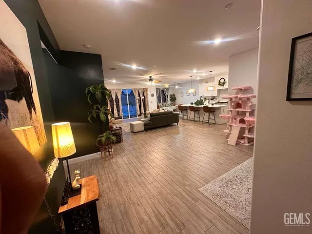 a view of a living room with furniture and a flat screen tv