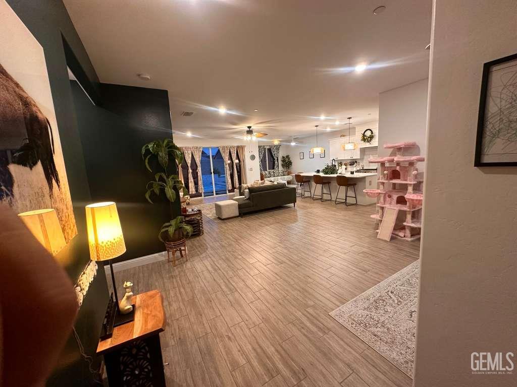 Undisclosed Address Shafter, CA 93263 - Photo 8 of 25 a view of a living room with furniture and a flat screen tv