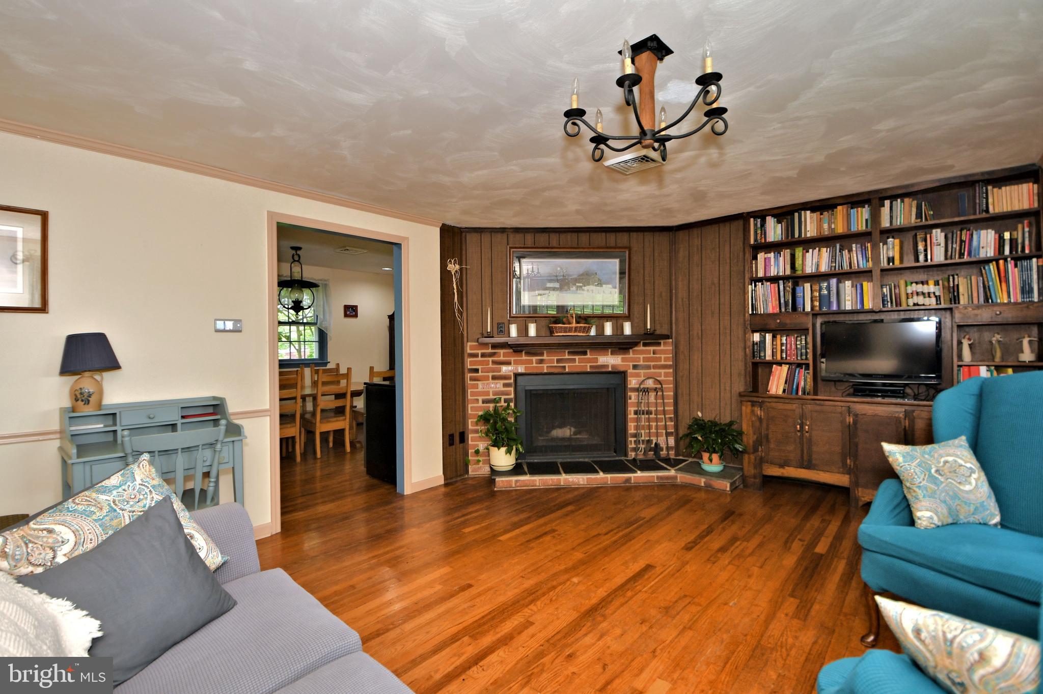 24 Moyer Road Telford, PA 18969 - Photo 8 of 62 a living room with furniture a fireplace and a flat screen tv