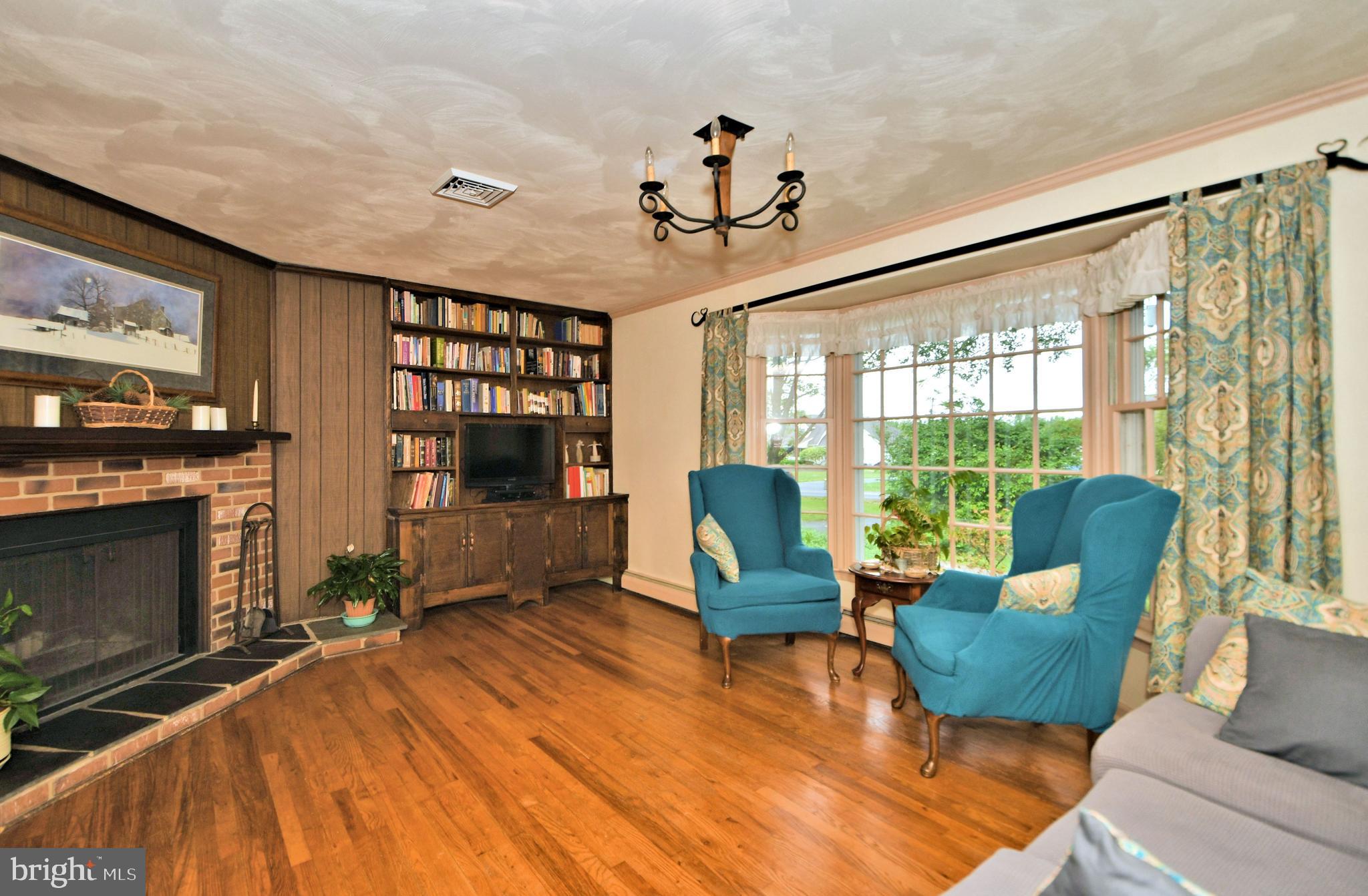 24 Moyer Road Telford, PA 18969 - Photo 9 of 62 a living room with furniture a flat screen tv and a fireplace