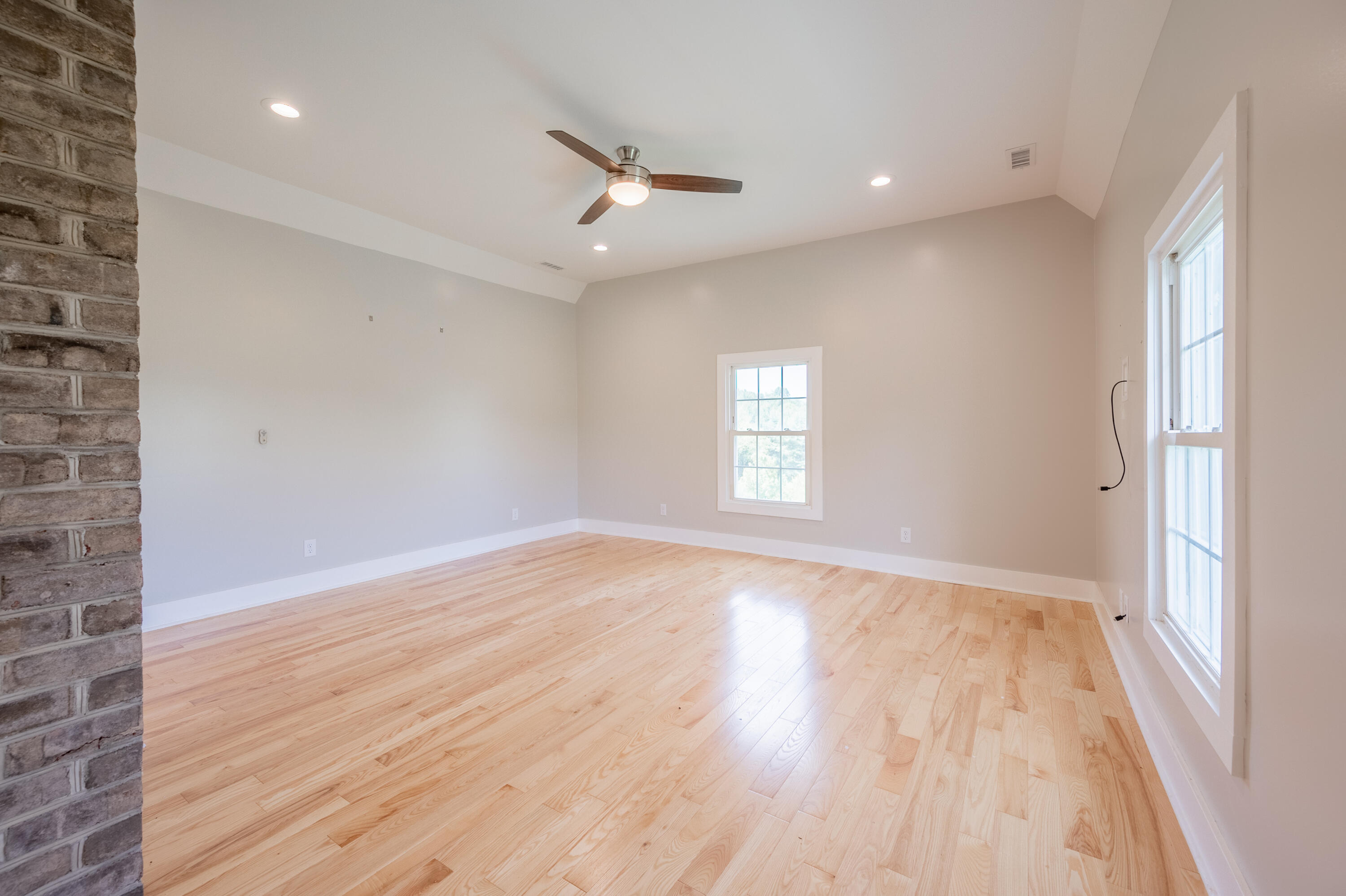 1463 Moore Road Northeast Floyd, VA 24091 - Photo 39 of 90 an empty room with wooden floor and windows