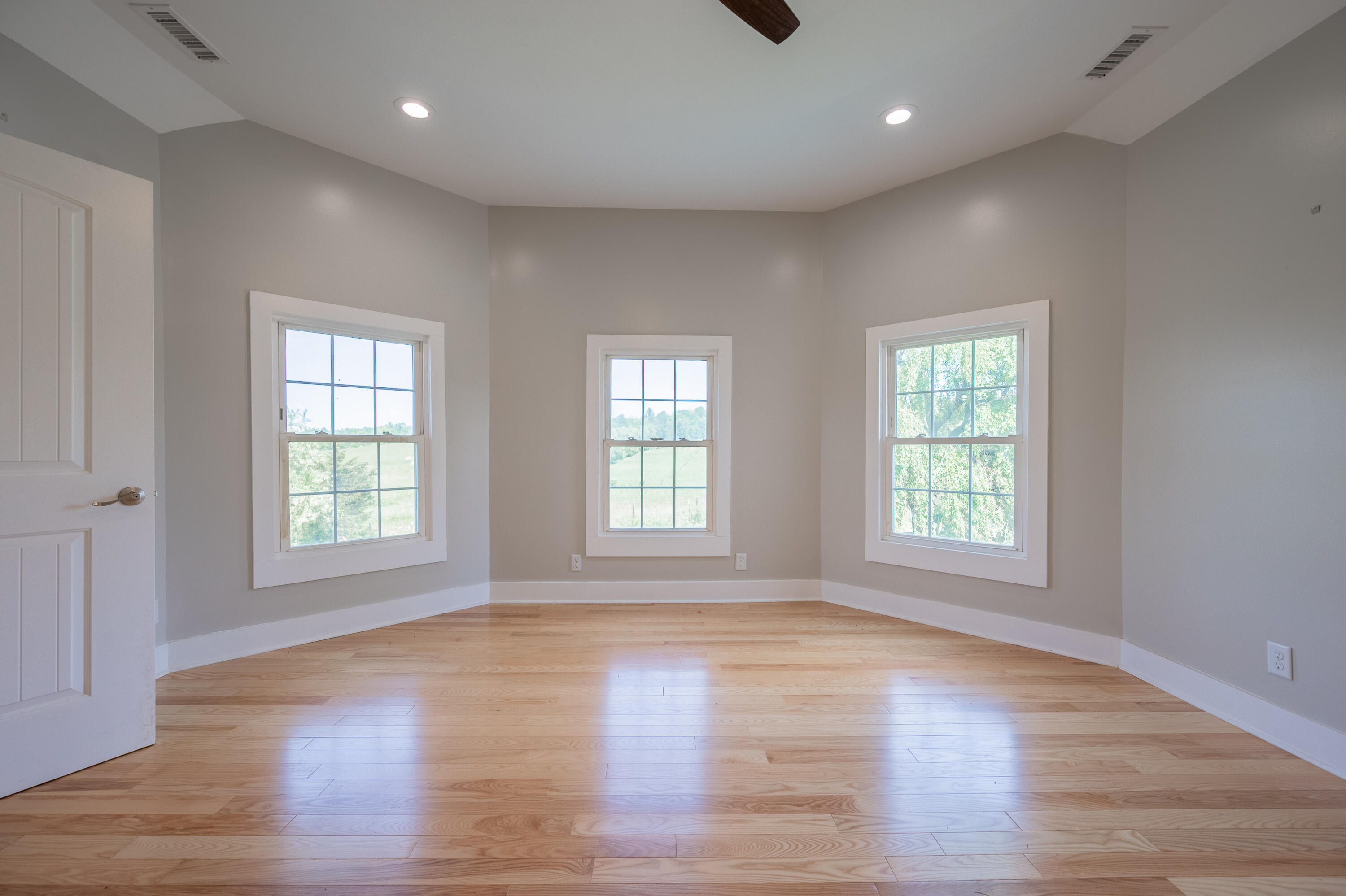 1463 Moore Road Northeast Floyd, VA 24091 - Photo 44 of 90 a view of an empty room with wooden floor and a window