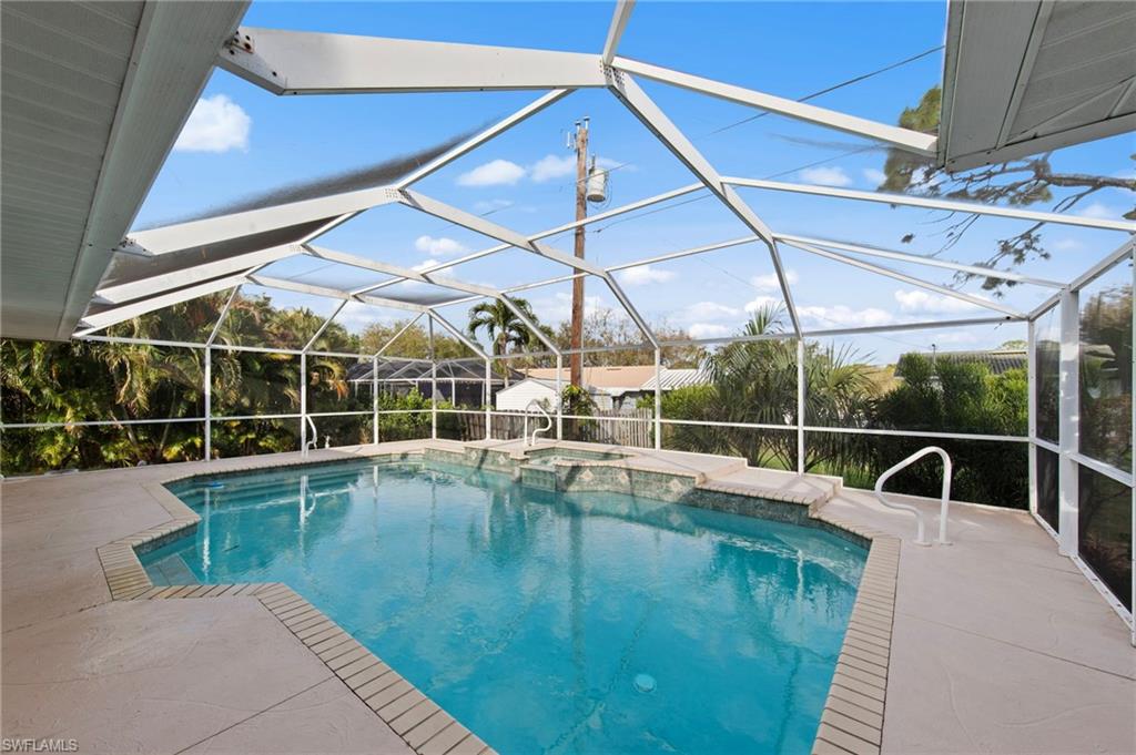 4724 Riverside Drive Estero, FL 33928 - Photo 29 of 44 a view of a swimming pool with a patio