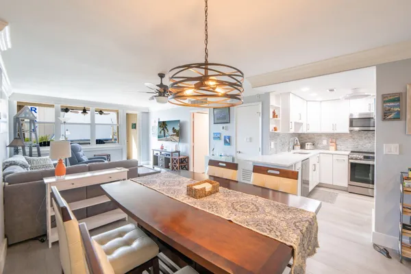a large kitchen with a table and chairs