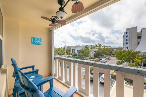 a view of a swimming pool with a lounge chair and a fire pit