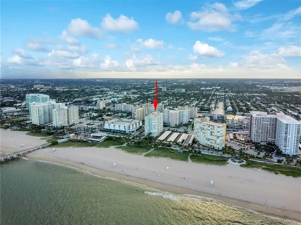 a kitchen with stainless steel appliances granite countertop a sink and a refrigerator