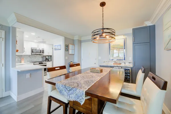 a large kitchen with a table and chairs