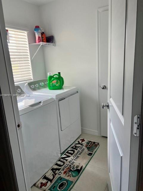 19709 Garden Ridge, Unit 19709 Lehigh Acres, FL 33974 - Photo 11 of 11 a room with white cabinets and appliances