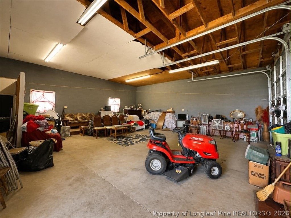 4435 Tartt's Mill Road Wilson, NC 27893 - Photo 22 of 23 a view of a garage with parked cars