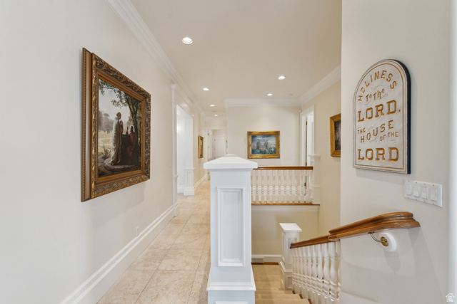 1714 Ridge Point Drive Bountiful, UT 84010 - Photo 47 of 132 Elegant second-floor hallway featuring recessed ceiling lighting, decorative framed artwork, white painted wainscoting, wood-finish handrail, and neutral wood-finish flooring throughout
