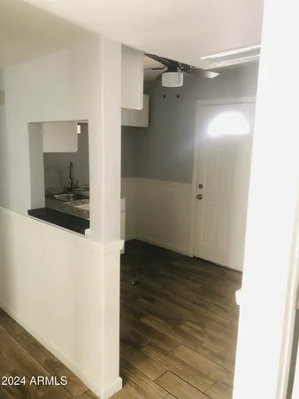 a view of an empty room with a window