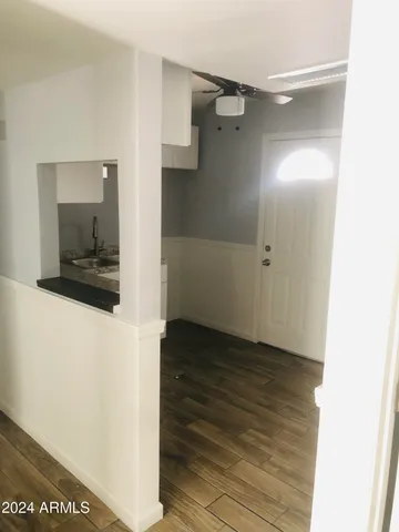 a view of an empty room with a window