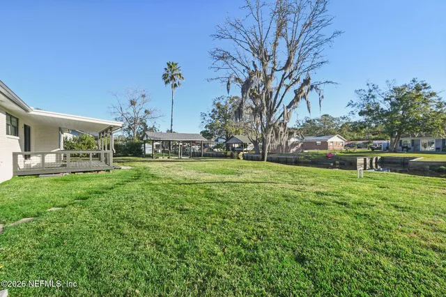 a bathroom with a sink double vanity and a shower
