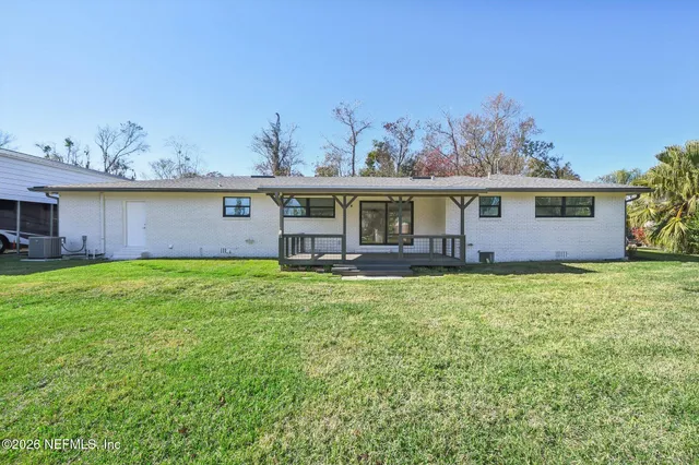 a bathroom with a shower and a sink