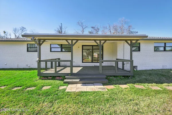 a bathroom with a shower and a sink