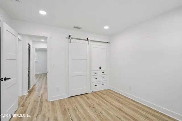 a front view of house with yard and trees