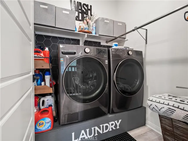 a utility room with dryer and washer