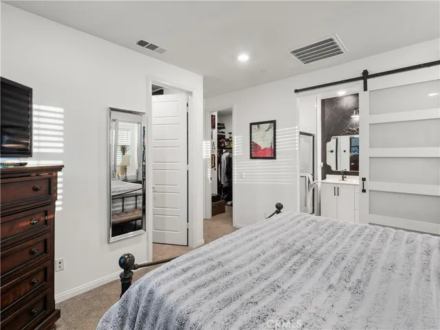 a bed room with a bed and a television