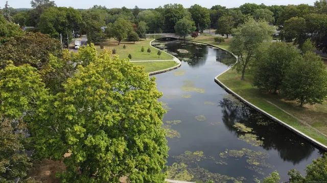 a view of a lake with a yard