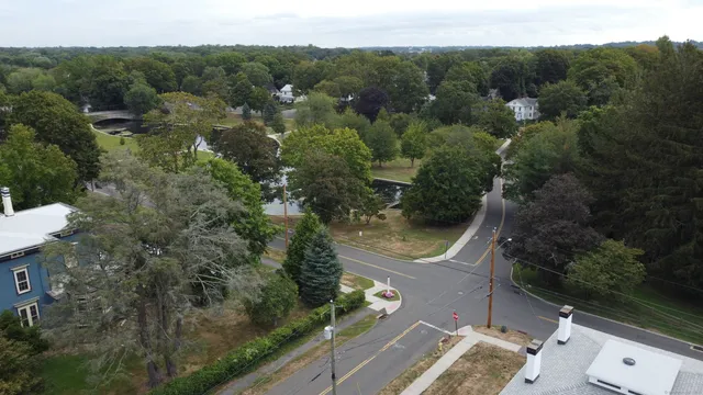 an aerial view of a house with a yard