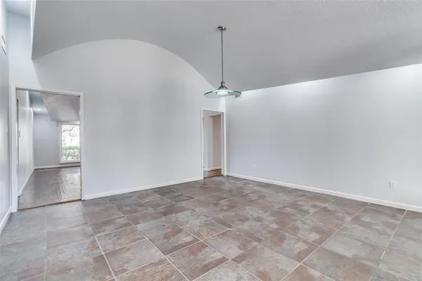 a view of an empty room with a fan