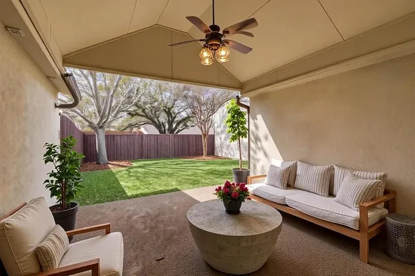 a living room with furniture and a yard