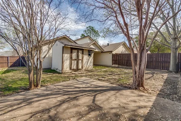 a view of a house with a yard covered in snow