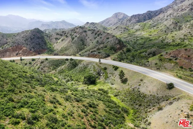 a view of a mountain from a yard