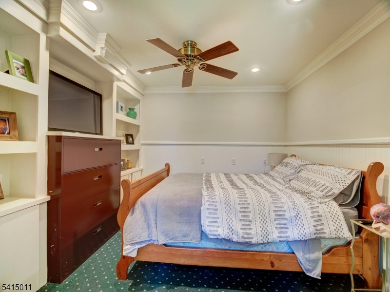 23 Ryerson Road Flemington, NJ 08822 - Photo 25 of 44 a bedroom with a bed and a chandelier