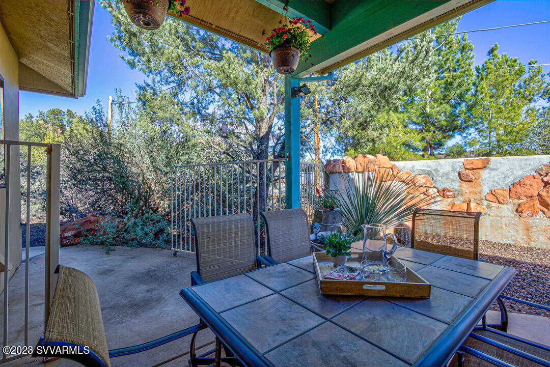 55 Roundup Road Sedona, AZ 86336 - Photo 17 of 35 a view of a patio with couches table and chairs and potted plants