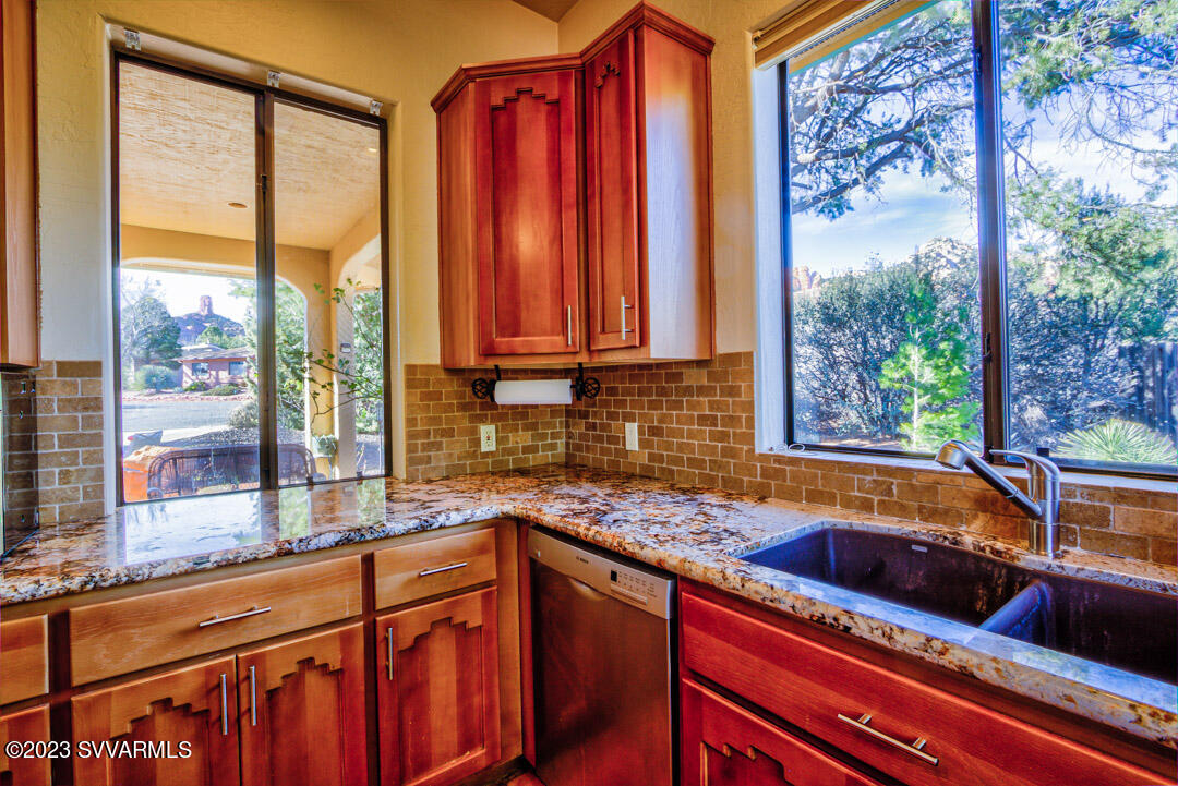 55 Roundup Road Sedona, AZ 86336 - Photo 20 of 35 a kitchen that has a sink and a large window