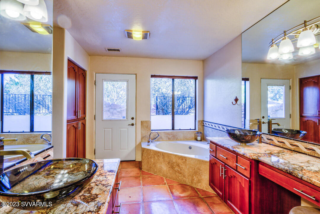 55 Roundup Road Sedona, AZ 86336 - Photo 24 of 35 a large spacious bathroom with a large tub and sink