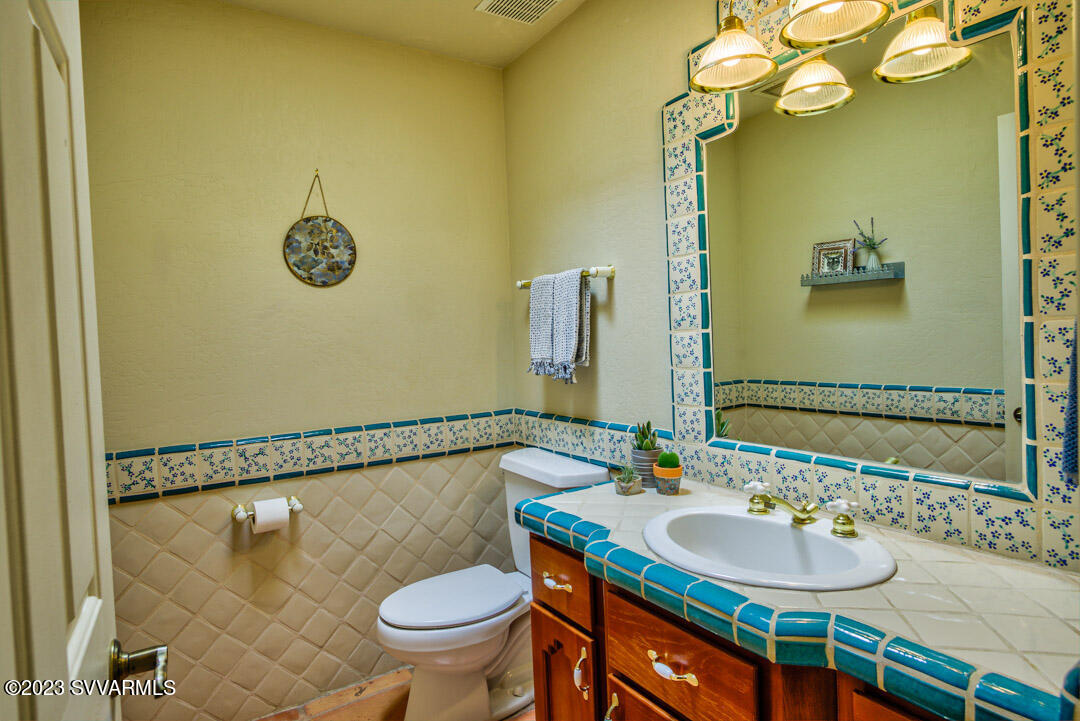 55 Roundup Road Sedona, AZ 86336 - Photo 28 of 35 a bathroom with a sink and a mirror