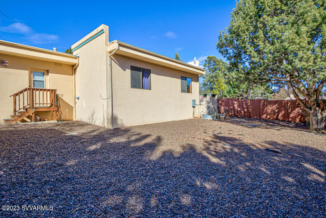 55 Roundup Road Sedona, AZ 86336 - Photo 31 of 35 a front view of a house with a yard