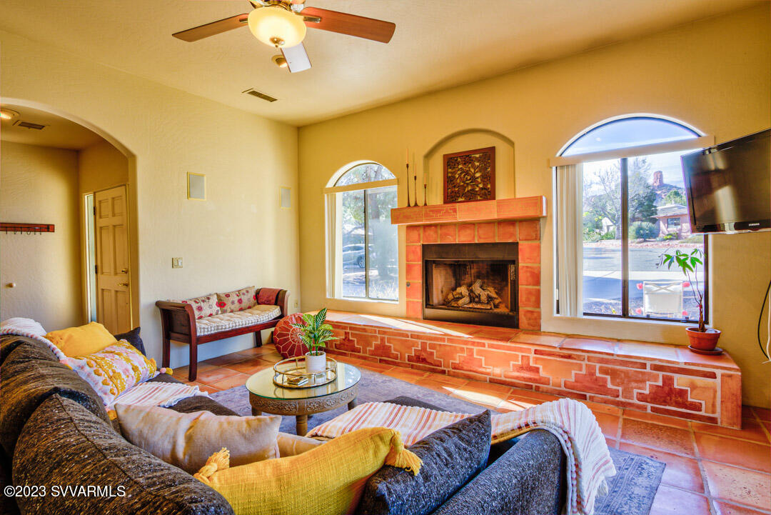 55 Roundup Road Sedona, AZ 86336 - Photo 7 of 35 a bedroom with bed and a fireplace