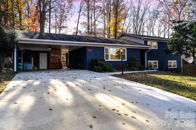a kitchen with granite countertop a sink stove and cabinets