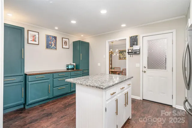 a hall with cabinets and wooden floor