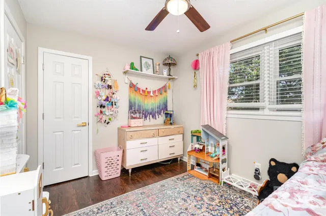 a bedroom with a bed and a mirror