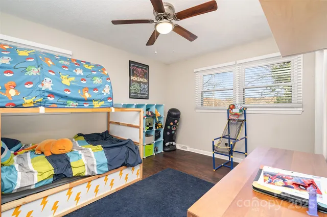a bathroom with a sink a toilet and shower curtain