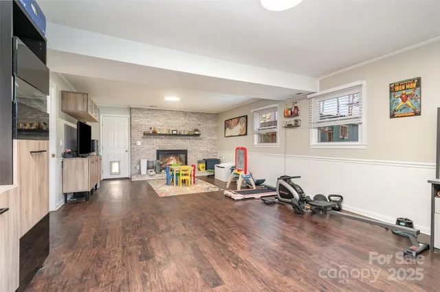 a view of a livingroom with furniture and a flat screen tv